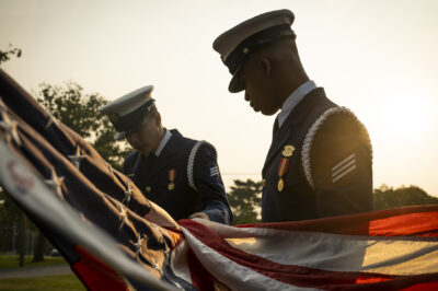 Photo: Members of the United States Coast Guard Ceremonial Honor Guard prepare for a flag raising ceremony at the Department of Homeland Security headquarters in Washington, D.C.