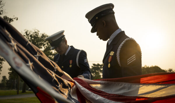 Photo: Members of the United States Coast Guard Ceremonial Honor Guard prepare for a flag raising ceremony at the Department of Homeland Security headquarters in Washington, D.C.