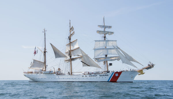 Color photograph of the U. S. Coast Guard Eagle (WIX 327) as it sets sale.