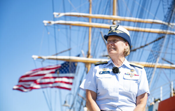 Color photograph of Coast Guard Commandant Adm. Linda L. Fagan in front of the Coast Guard Cutter Eagle in New London, CT.