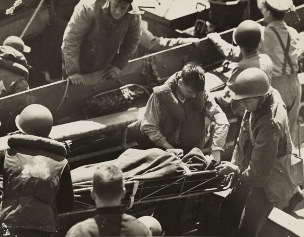 Photo: Medics tending to the wounded aboard ship.