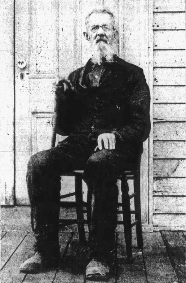 Photo: Joseph Napier seated on the porch.
