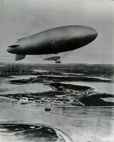 Photo: Blimp above a base.