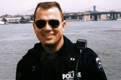 Candid photo of Vincent G. Danz in his NYPD uniform at the waterfront.