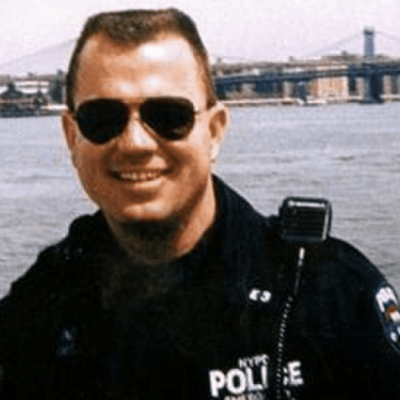 Candid photo of Vincent G. Danz in his NYPD uniform at the waterfront.