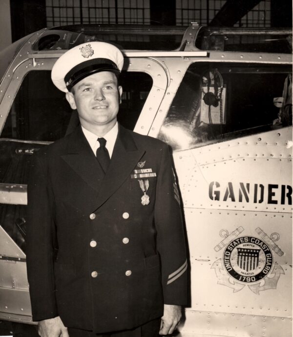 Photo: Gus Jablonski shows off his decoration while posing next to the Gander Express.