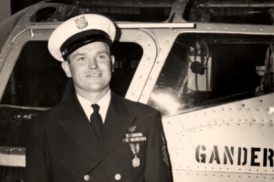 Photo: Gus Jablonski shows off his decoration while posing next to the Gander Express.