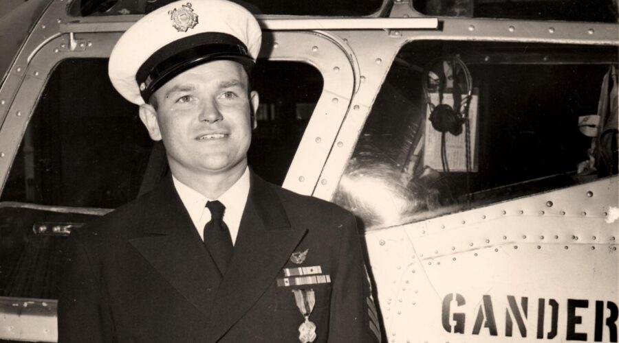 Photo: Gus Jablonski shows off his decoration while posing next to the Gander Express.