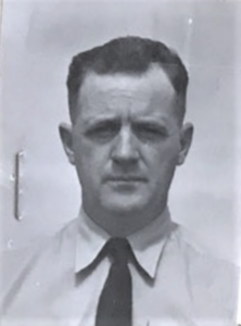 Photo: Headshot photograph of LT Robert S. Hoyle in khaki uniform