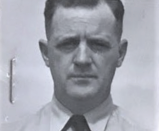 Photo: Headshot photograph of LT Robert S. Hoyle in khaki uniform