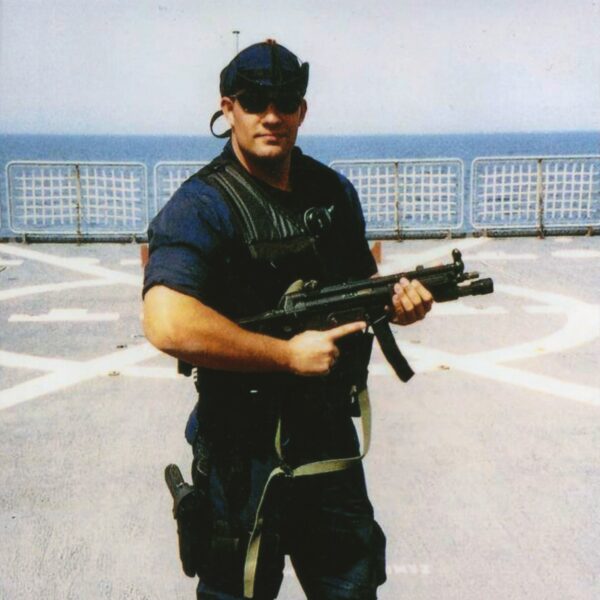 Photo: Nathan Bruckenthal poses with his gun.