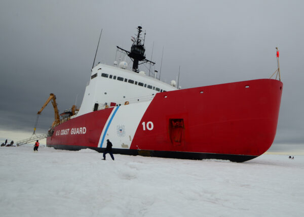 Photo: Polar Star and crew engage in crane operation on the ice.
