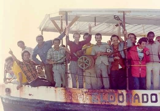 Photo: Cuban refugees crowd the rails of a fishing vessel marked Eldorado.