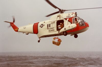 Color photo of Coast Guard HH-52 “Seaguard” helicopter.