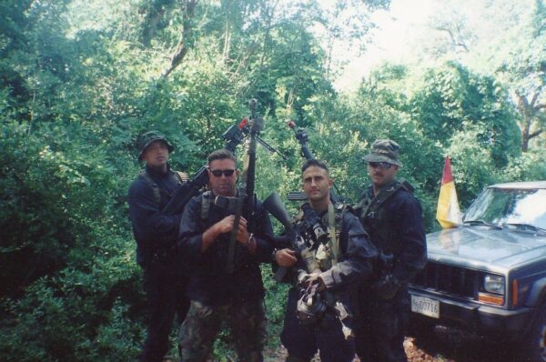 Photo: Rodriguez with fellow Coast Guard DIAT team members in camo gear.