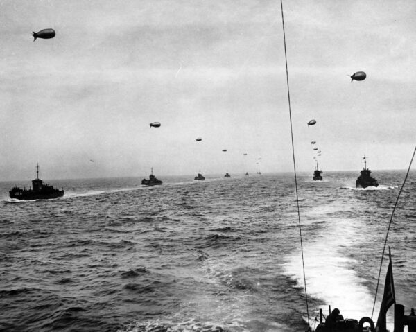 Photo: USCG LCIs with flying barrage balloons.