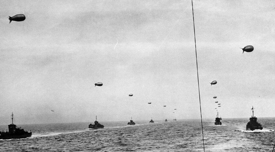 Photo: USCG LCIs with flying barrage balloons.