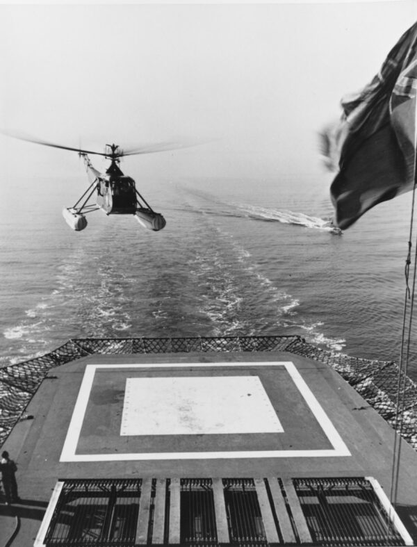 Photo: Helicopter coming in for a landing on a ship.