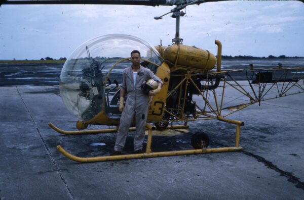 A color picture of LT Bobby Wilks standing in front of a helicopter.