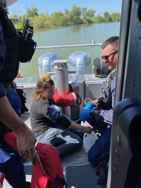Photo: An MSST member provides first aid to family.