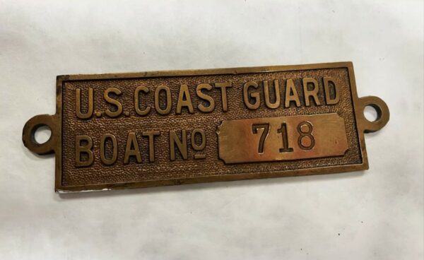 Ship placard bearing the text “U.S. Coast Guard Boat No. 718”