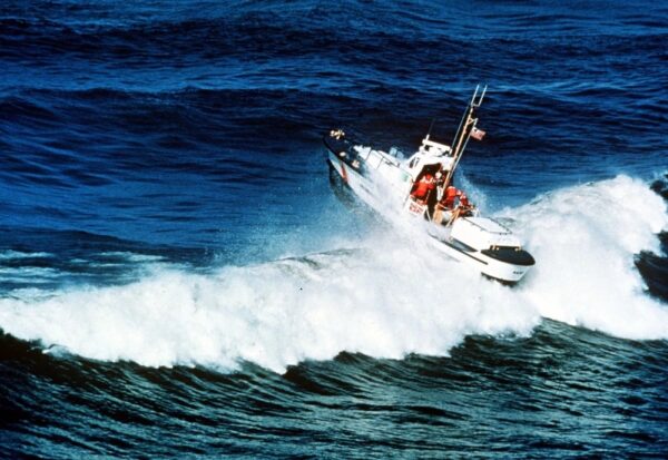 Photo: A 44-foot motor lifeboat powering through heavy breakers common to the West Coast.