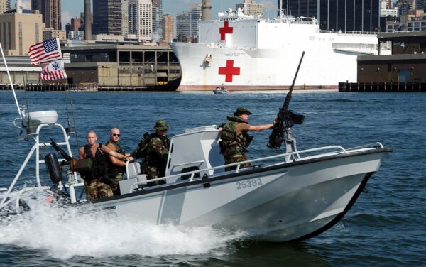 Photo: A Coast Guard port security unit boat speeds through New York Harbor.