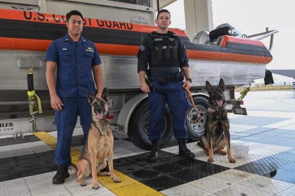 Photo: CEDT handlers pose with their canine partners.