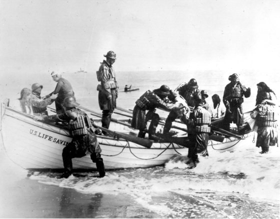 Photo: Crew lands a boat on the beach.