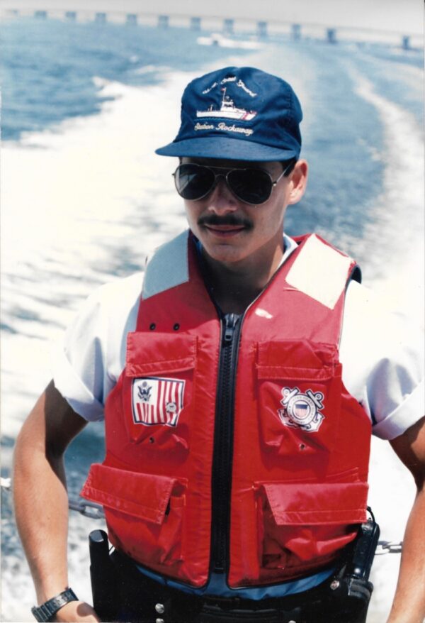 Photo: Jeffrey Palazzo at rear of vessel in life jacket.