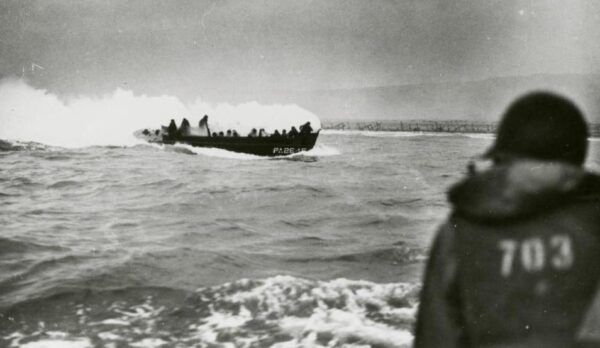 Photo: An American landing craft on fire off Omaha Beach