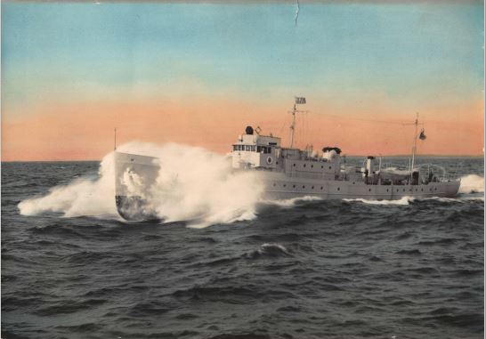 Photo: Colorized black and white photo of cutter Thetis breaking through the waves.