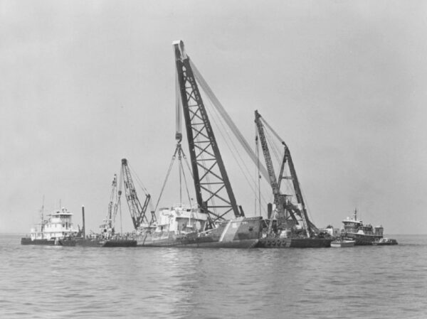 Photo: a number of tenders and cranes huddle together with Blackthorn being raised.