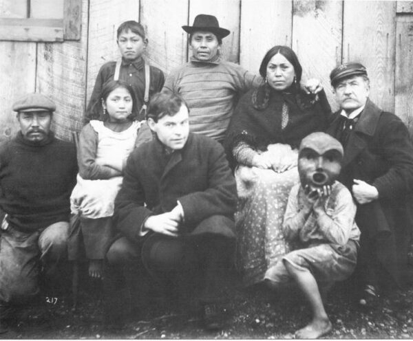 Photograph: Capt. Dorr F. Tozier (right) posing with a group Native Americans