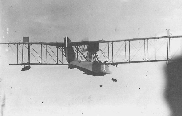 Photo: HS-1 flying boat in flight dropping bombs.