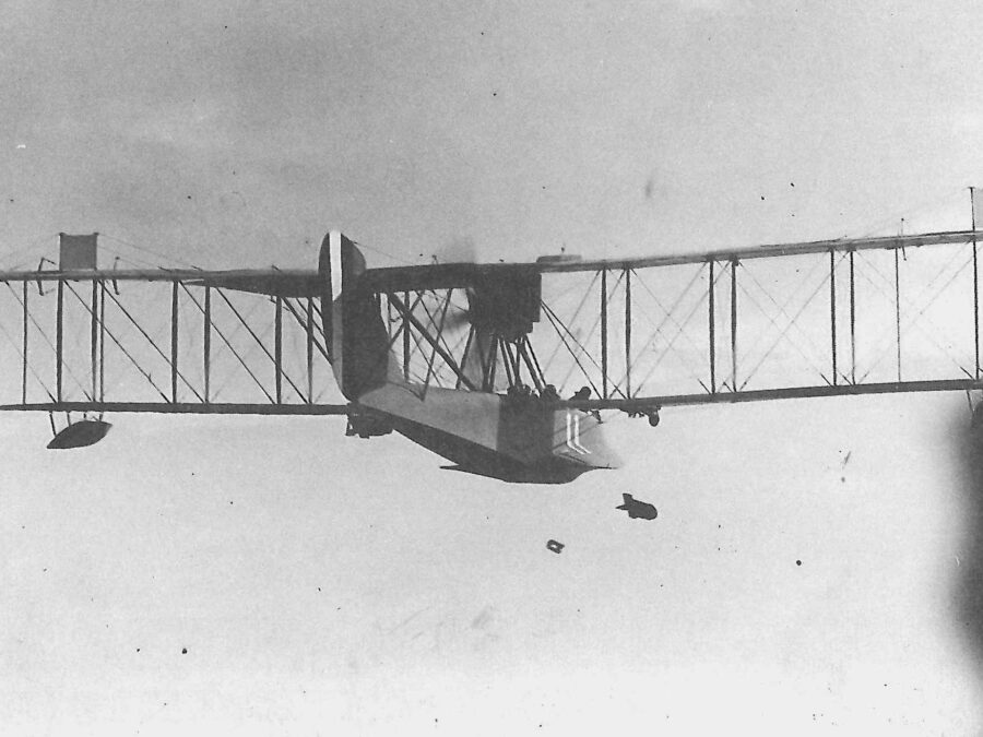 Photo: HS-1 flying boat in flight dropping bombs.