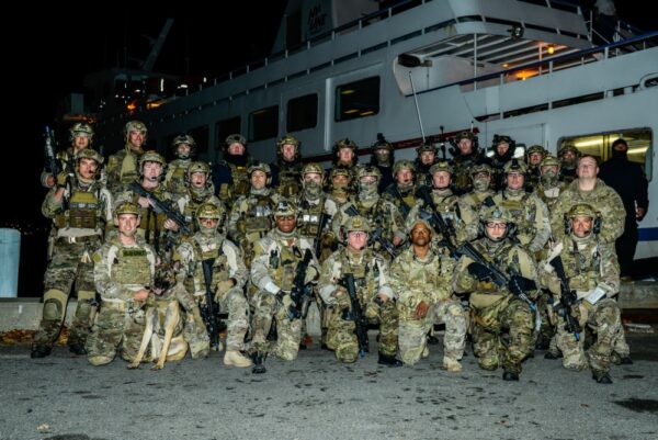 Photo: MSRT members in group photo in camouflage gear