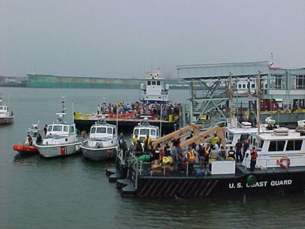 Photo: Coast Guard boats along with private barges assemble.
