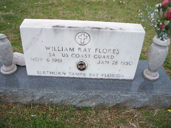 Photo: Headstone with text: William Ray Flores, 5A U.S. Coast Guard, Nov 6 1961 – Jan 28 1980, Blkthorn Tampa Bay Florida