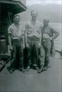 Photo: Joe Gerczak (standing left) with two shipmates on board LST-66.