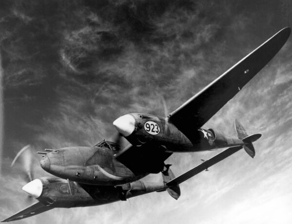 Photo: P-38 airplane in flight as seen from below.