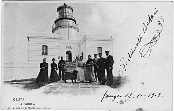 Photo: Towermen in uniform with similar light house to Caja de Muerto Light.