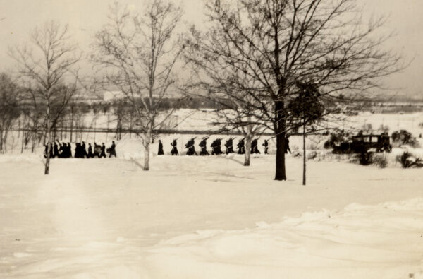 Photo: Military honor guard marches through the snow at Arlington National Cemetery