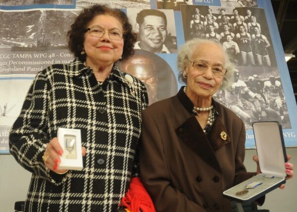 Photo: Vivian Robinson and Catherine Robinson pose with Emlen Tunnell’s medal.