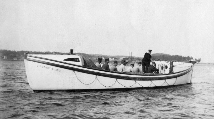 Photo: Port view of a Type “E” motor surfboat with crew.