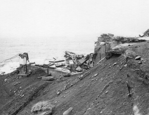 Photo of the remains of Scotch Cap Lighthouse taken from the bluff after the 1946 tsunami.