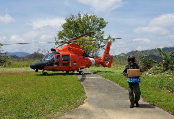 Photo: Supplies being delivered by helicopter.