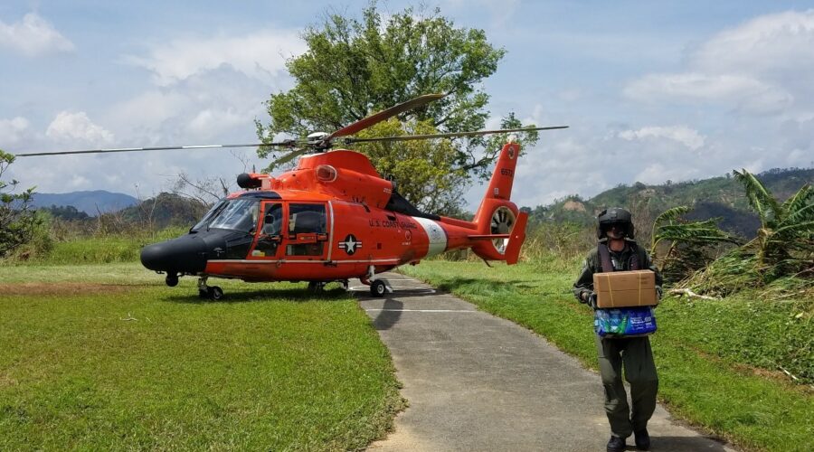 Photo: Supplies being delivered by helicopter.