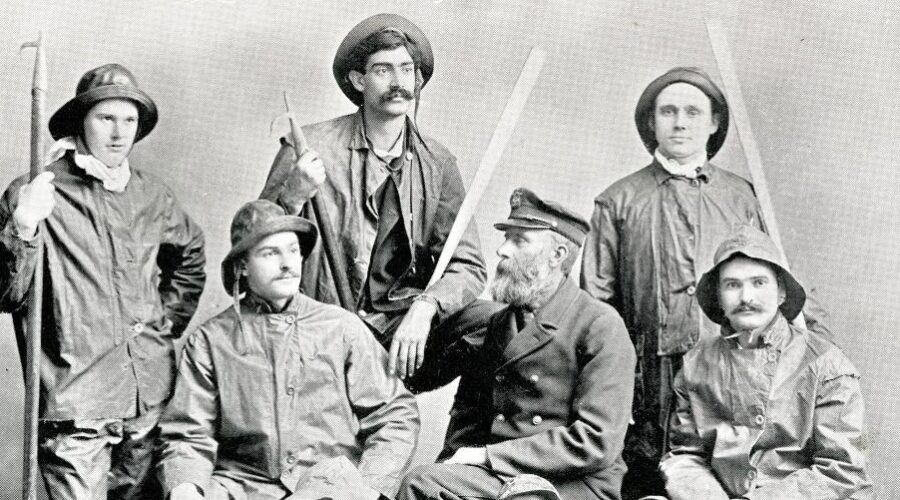 1894 posed photograph of Keeper Lawson surrounded by his NWU student surfmen.