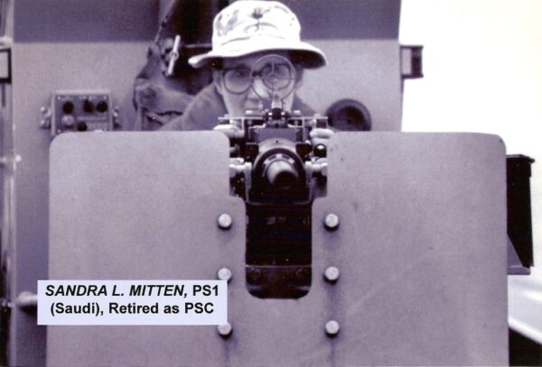 Photo: Sandy Mitten peers through the sights of her gun.